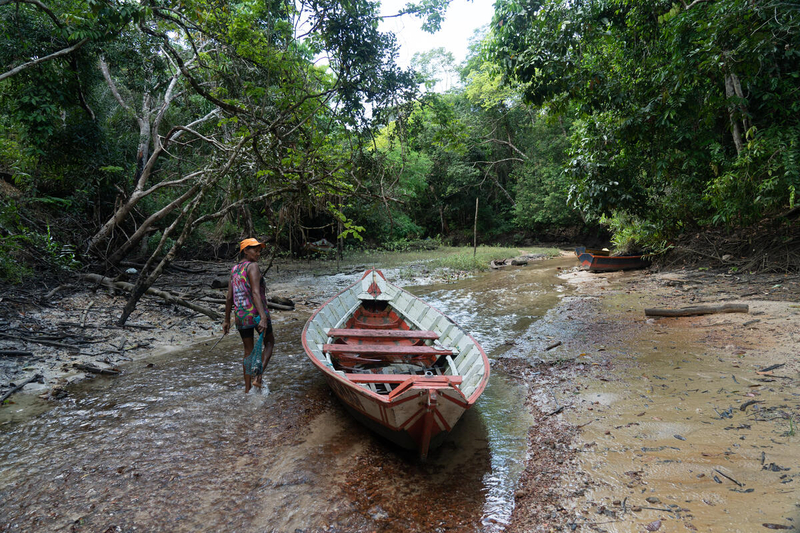 Curuça, Pará, Brazil - 2022/07/22: Laiz Rodriguez de Araujo and her neighbor, Yselena Rodriguez de Araujo (featured) head out of the mangrove forest with their caught crabs in hand. 

National Geographic Explorers Angelo Bernardino and Margaret Owuor are working with local communities in the Curuça region at the mouth of the Amazon to map the ecosystem services  provided by the mangrove forests in this unique environment, and determine their economic value. 

The National Geographic and Rolex Perpetual Planet Amazon Expedition is an extensive science and storytelling journey that spans the entire Amazon River Basin from the Andes to the Atlantic. This two-year exploration of the Amazon leverages local National Geographic Explorers, multiple science disciplines, and photojournalism to illuminate the diversity and connectivity of the people, wildlife, and ecosystems that make up this critical region, and the solutions needed to ensure its protection.